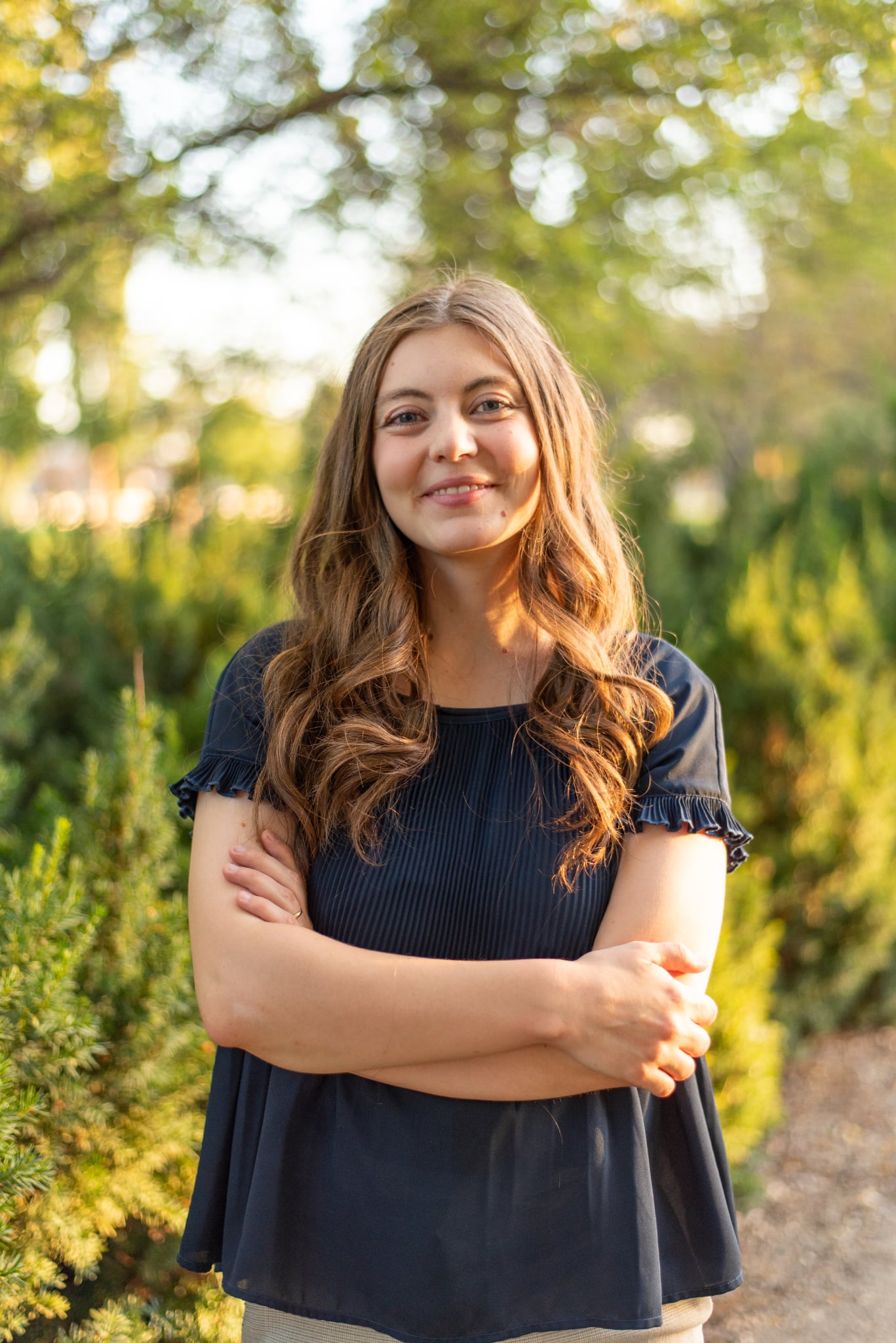 Madison, a licensed therapist in Utah, smiling outdoors